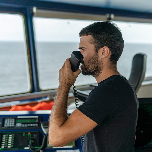 Marine navigational officer is reporting by VHF radio